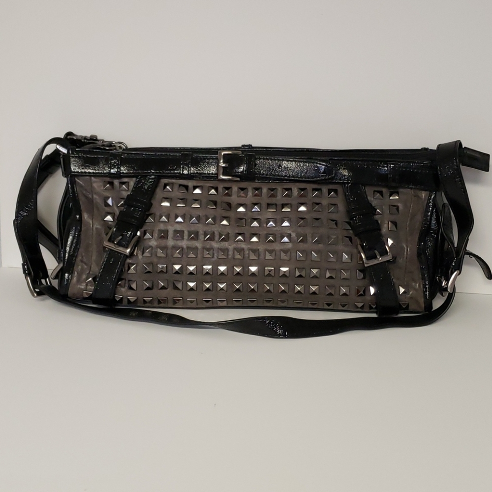 Black patent leather trimmed studded clutch